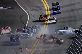 DAYTONA BEACH, FL - FEBRUARY 19: Christopher Bell, driver of the #4 JBL Toyota, Timmy Hill, driver of the #49 Hormone Therapeutics Chevrolet, and John H Nemechek, driver of the #8 farbe technik Chevrolet, have an on track incident during the NASCAR Camping World Truck Series NextEra Energy Resources 250 at Daytona International Speedway on February 19, 2016 in Daytona Beach, Florida. (Photo by Jared C. Tilton/Getty Images)