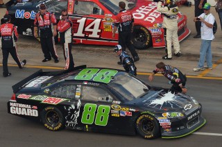 BROOKLYN, MI - JUNE 17: Dale Earnhardt Jr., driver of the #88 Diet Mountain Dew/TheDarkKnightRises/National Guard/ Chevrolet, is congratulated along pit road after winning the NASCAR Sprint Cup Series Quicken Loans 400 at Michigan International Speedway on June 17, 2012 in Brooklyn, Michigan. (Photo by Drew Hallowell/Getty Images for NASCAR)
