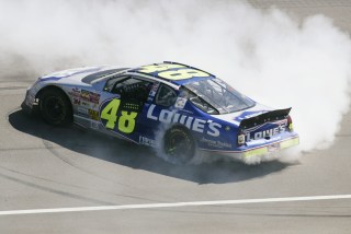 28 Apr 2002: Gordon Racing driver Jimmie Johnson celebrates by doing donuts on the front stretch after winning the NASCAR Winston Cup Series NAPA Auto Parts 500 at the California Speedway in Fontana, California.DIGITAL IMAGE. Mandatory Credit: Jeff Gross/Getty Images.