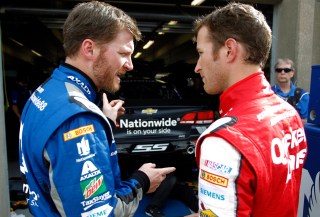 Dale Earnhardt Jr. (left) and Kasey Kahne discuss pre-race strategy prior to Saturday night's Duck Commander 500 at Texas Motor Speedway. All four Hendrick Motorsports drivers finished in the top 8, including Earnhardt (2nd) and Kahne (8th).