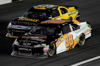 CHARLOTTE, NC - MAY 19: Dale Earnhardt Jr., driver of the #88 Dale Jr. Foundation/National Guard/Diet Mountain Dew Chevrolet, and Marcos Ambrose, driver of the #9 DEWALT Ford, race during the NASCAR Sprint All-Star Race at Charlotte Motor Speedway on May 19, 2012 in Charlotte, North Carolina. (Photo by John Harrelson/Getty Images for NASCAR)