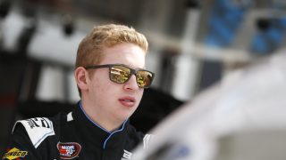 NEWTON, IOWA - MAY 16: Kyle Benjamin, driver of the #27 Eibach Ford stands in the garage area during practice for the NASCAR K&N Pro Series Casey's General Store 150 at Iowa Speedway on May 16, 2015 in Newton, Iowa. (Photo by Jeff Zelevansky/Getty Images)