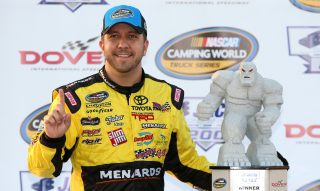 DOVER, DE - MAY 13: Matt Crafton, driver of the #88 Chi-Chi's/Menards Toyota, poses with the trophy in Victory Lane after winning the NASCAR Camping World Truck Series JACOB Companies 200 at Dover International Speedway on May 13, 2016 in Dover, Delaware. (Photo by Sean Gardner/Getty Images)