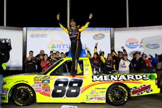 HAMPTON, GA - FEBRUARY 28: Matt Crafton, driver of the #88 Fisher Nuts/Menards Toyota, celebrates in victory lane after winning the NASCAR Camping World Truck Series Hyundai Construction Equipment 200 on February 28, 2015 in Hampton, Georgia. (Photo by Jerry Markland/Getty Images)