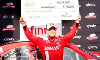 INDIANAPOLIS, IN - JULY 23: Justin Allgaier, driver of the #7 BRANDT Chevrolet, celebrates after winning the Dash for Cash at the NASCAR XFINITY Series Lilly Diabetes 250 at Indianapolis Motor Speedway on July 23, 2016 in Indianapolis, Indiana. (Photo by Brian Lawdermilk/Getty Images)