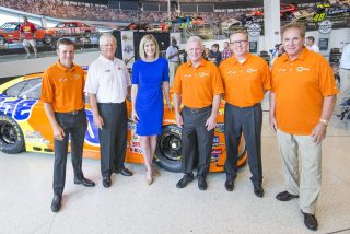 From left: NASCAR Sprint Cup Series driver Matt Kenseth, team owner Joe Gibbs, Tide Brand Manager Amy Krehbiel, and former Tide Legend drivers Ricky Rudd, Ricky Craven and Darrell Waltrip pose for a photo in front of the newly unveiled No. 20 Tide PODS Toyota Camry paint scheme at the NASCAR Hall of Fame in Charlotte, NC Tuesday, August 16, 2016. (Jason E. Miczek/AP Images for Tide PODS)