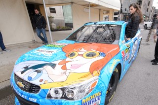 CHICAGO, IL - APRIL 26: Danica Patrick drives the No. 10 April O'Neil/Nature's Bakery Chevrolet SS down Michigan Avenue during Nickelodeon And Chicagoland Speedway Team Up With Danica Patrick To Announce Teenage Mutant Ninja Turtles 400 Race On Sept. 18 at Wrigley Square at Millenium Park on April 26, 2016 in Chicago, Illinois. (Photo by Daniel Boczarski/Getty Images for Nickelodeon)