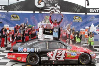 JOLIET, IL - SEPTEMBER 19: Tony Stewart, driver of the #14 Office Depot/Mobil 1 Chevrolet, celebrates in victory lane after winning the NASCAR Sprint Cup Series GEICO 400 at Chicagoland Speedway on September 19, 2011 in Joliet, Illinois. (Photo by Jerry Markland/Getty Images for NASCAR)