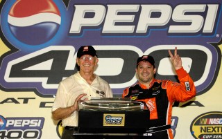 DAYTONA BEACH, FL. - JULY 2: Team owner Joe Gibbs and Tony Stewart, driver of the #20 Home Depot Chevrolet, celebrate winning the NASCAR Nextel Cup Series Pepsi 400 on July 2, 2005 at the Daytona International Speedway in Daytona Beach, Florida. ( Photo by Rusty Jarrett/Getty Images )