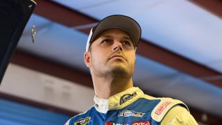 TALLADEGA, AL - OCTOBER 21: David Gilliland, driver of the #35 Dockside Logistics Ford, stands in the garage area during practice for the NASCAR Sprint Cup Series Hellmann's 500 at Talladega Superspeedway on October 21, 2016 in Talladega, Alabama. (Photo by Jared C. Tilton/Getty Images)