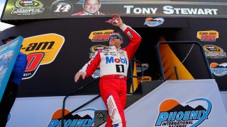 AVONDALE, AZ - NOVEMBER 13: Tony Stewart, driver of the #14 Mobil 1 Chevrolet, walks on stage during driver introductions prior to the NASCAR Sprint Cup Series Can-Am 500 at Phoenix International Raceway on November 13, 2016 in Avondale, Arizona. (Photo by Jonathan Ferrey/Getty Images)