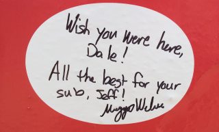 A fan's note to Dale Earnhardt and his sub, Jeff Gordon, on the No. 88 team's pit wall at Indianapolis Motor Speedway (Photo: Dustin Long)