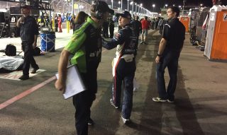 William Byron (center) is offered condolences after shortly after his truck blew an engine while leading at Phoenix in November. A win would have put Byron in the title race in Miami in the Camping World Truck Series. (Photo: Dustin Long)