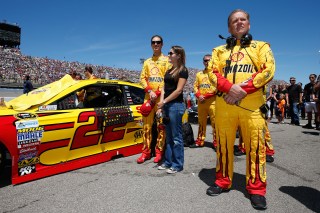 BROOKLYN, MI - JUNE 12: (L-R) Joey Logano, driver of the #22 Shell Pennzoil Ford, wife Brittany Logano and crew chief Todd Gordon stand on the grid prior to the NASCAR Sprint Cup Series FireKeepers Casino 400 at Michigan International Speedway on June 12, 2016 in Brooklyn, Michigan. (Photo by Todd Warshaw/Getty Images )