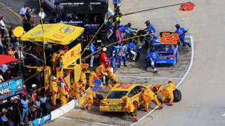 MARTINSVILLE, VA - OCTOBER 30: Martin Truex Jr, driver of the #78 Auto-Owners Insurance Toyota, and Joey Logano, driver of the #22 Shell Pennzoil Ford, pit during the NASCAR Sprint Cup Series Goody's Fast Relief 500 at Martinsville Speedway on October 30, 2016 in Martinsville, Virginia. (Photo by Daniel Shirey/Getty Images)